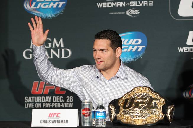 Chris Weidman waves during a news conference to promote his December fight against Anderson Silva at UFC 168 Tuesday, Sept. 24, 2013.