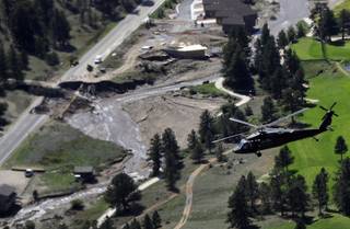 This aerial photo shows flood damage in Greeley Colo. during a helicopter tour of flood-ravaged areas by Vice President Joe Biden, Gov. John Hickenlooper, and FEMA officials Monday, Sept. 23, 2013.