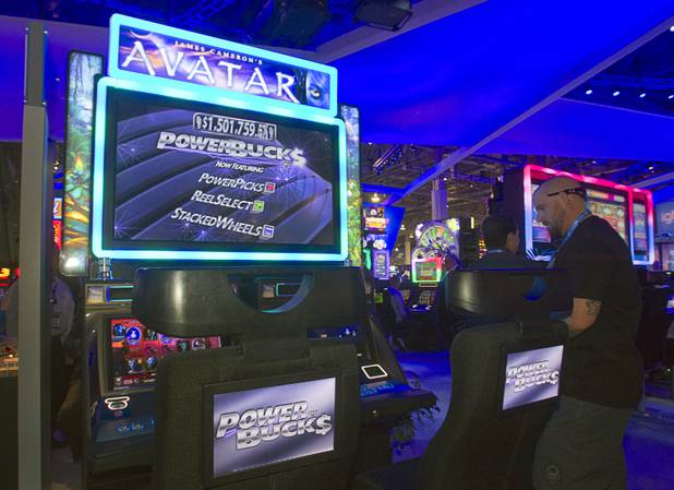 An IGT video slot machine promotes Power Bucks during the G2E convention at the Sands Expo Center Wednesday, Sept. 25, 2013.  Power Bucks is a "bolt-on" progressive, meaning casinos can digitally connect it to any IGT slot machine to make it a progressive. When Power Bucks is enabled, a progressive tracker appears at the top of the screen. 