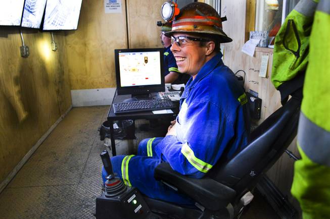 Some miners, like David Youny, operate equipment remotely at Newmont Mining Corp.'s Leeville underground mine. Here, Youny can work the rock breaker with joysticks and television monitors, Sept. 26, 2013.  Mark Ward, mine manager, said remote operations can protect miners.