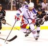 Los Angeles Kings center Jarret Stoll tries to get the puck from New York Rangers forward Rick Nash during their preseason game Friday, Sept. 27, 2013 at the MGM Grand Garden Arena. The Kings won 4-1.