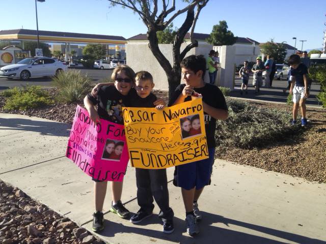 Snowcone fundraiser for the family of Cesar Navarro, a 9-year-old boy who was allegedly killed by his teenage brother last week at their Henderson home. From L to R; Loren Ambrose, Rylan McKinnon and Nicolas Araya