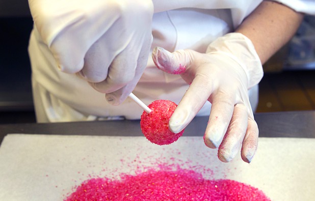 Pastry chef Katie Ward makes a cake pop at Red Rock Resort Tuesday, Oct. 1, 2013. Station Casinos is hosting its fourth annual "Project Pink" initiative for National Breast Cancer Awareness Month. Throughout October, the majority of station properties will donate a portion of its proceeds from Project Pink retail sales and Pink gaming winnings to the Southern Nevada affiliate of Susan G. Komen, an organization supporting breast cancer research.