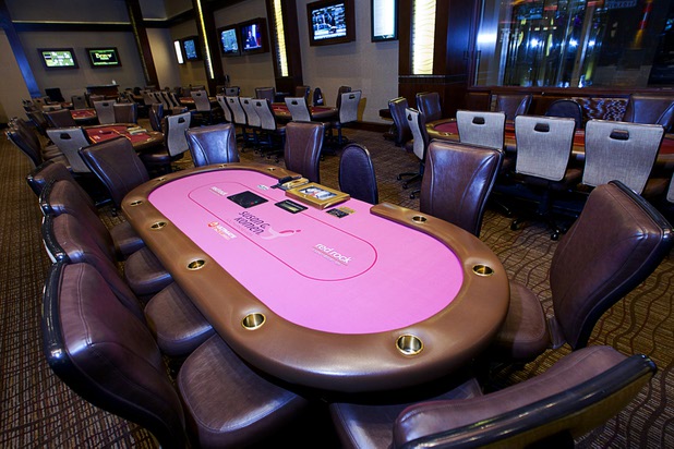 A poker table with pink felt is shown at the Red Rock Resort poker room Tuesday, Oct. 1, 2013. Station Casinos is hosting its fourth annual "Project Pink" initiative for National Breast Cancer Awareness Month. Proceeds from "Poker Goes Pink" will be raised throughout the Oct. 19-20 weekend. Poker table felts were donated by The Layout Company.