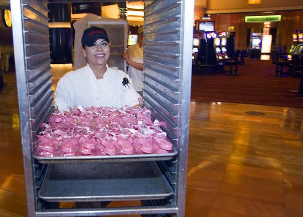 Baker Cathy Lopez moves fresh baked goods to the Grand Cafe at Red Rock Resort Tuesday, Oct. 1, 2013. Station Casinos is hosting its fourth annual "Project Pink" initiative for National Breast Cancer Awareness Month. Throughout October, the majority of station properties will donate a portion of its proceeds from Project Pink retail sales and Pink gaming winnings to the Southern Nevada affiliate of Susan G. Komen, an organization supporting breast cancer research.