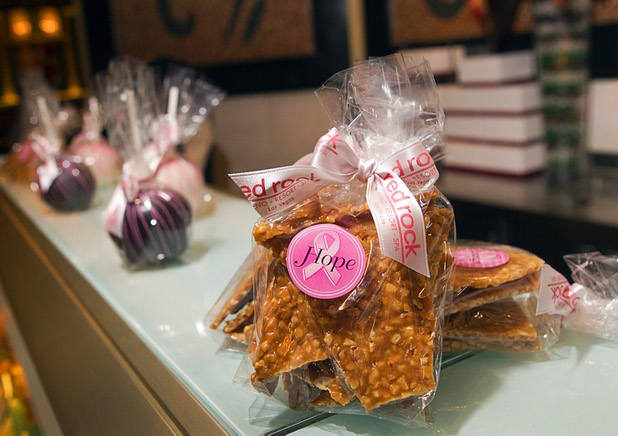 Bags of peanut brittle are displayed in the Grand Cafe at Red Rock Resort Tuesday, Oct. 1, 2013. Station Casinos is hosting its fourth annual "Project Pink" initiative for National Breast Cancer Awareness Month. Throughout October, the majority of station properties will donate a portion of its proceeds from Project Pink retail sales and Pink gaming winnings to the Southern Nevada affiliate of Susan G. Komen, an organization supporting breast cancer research.