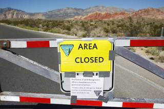 The gates to Red Rock National Conservation Area are seen closed because of the federal government shutdown Tuesday, Oct. 1, 2013.