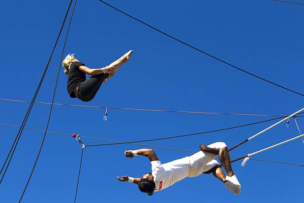 Taelyr Lazaris, 20, practices with catcher Izzie Yaakub, 33, Terry Cavaretta Trapeze Experience, 1400 N. Rampart Blvd., Wednesday, Oct. 2, 2013. The Trapeze Experience will celebrate their grand opening at the Las Vegas Sports Park Friday, Oct. 4. There will be a free show, open to the public, from 4 p.m. to 6 p.m.