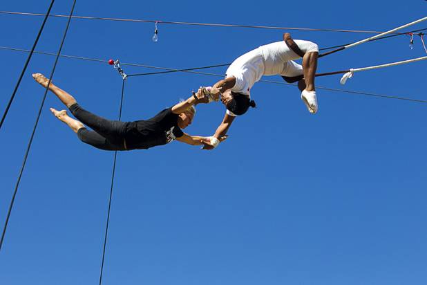 Taelyr Lazaris, 20, practices with catcher Izzie Yaakub, 33, Terry Cavaretta Trapeze Experience, 1400 N. Rampart Blvd., Wednesday, Oct. 2, 2013. The Trapeze Experience will celebrate their grand opening at the Las Vegas Sports Park Friday, Oct. 4. There will be a free show, open to the public, from 4 p.m. to 6 p.m.