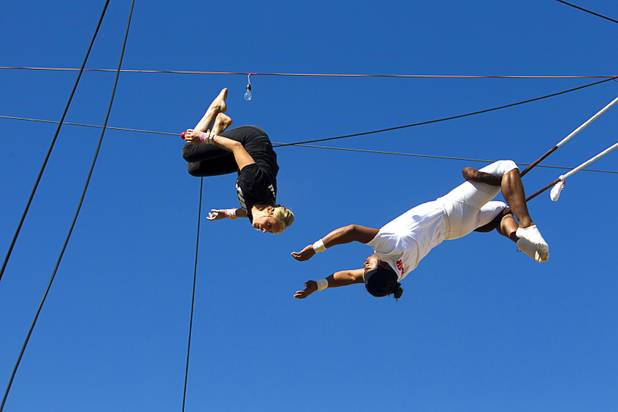 Taelyr Lazaris, 20, practices with catcher Izzie Yaakub, 33, Terry Cavaretta Trapeze Experience, 1400 N. Rampart Blvd., Wednesday, Oct. 2, 2013. The Trapeze Experience will celebrate their grand opening at the Las Vegas Sports Park Friday, Oct. 4. There will be a free show, open to the public, from 4 p.m. to 6 p.m.
