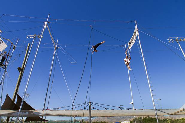 Taelyr Lazaris, 20, practices with catcher Izzie Yaakub, 33, Terry Cavaretta Trapeze Experience, 1400 N. Rampart Blvd., Wednesday, Oct. 2, 2013. The Trapeze Experience will celebrate their grand opening at the Las Vegas Sports Park Friday, Oct. 4. There will be a free show, open to the public, from 4 p.m. to 6 p.m.