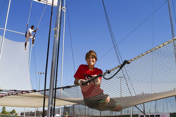 Terry Cavaretta-St.Jules, 60, owner of Terry Cavaretta Trapeze Experience poses with catcher Izzie Yaakub, 33, at the Las Vegas Sports Park, 1400 N. Rampart Blvd., Wednesday, Oct. 2, 2013. The Trapeze Experience will celebrate their grand opening at the Sports Park Friday, Oct. 4. There will be a free show, open to the public, from 4 p.m. to 6 p.m.