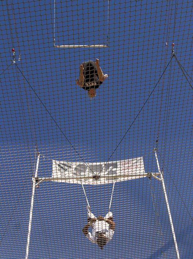 Taelyr Lazaris, top, 20, practices with catcher Izzie Yaakub, 33, Terry Cavaretta Trapeze Experience, 1400 N. Rampart Blvd., Wednesday, Oct. 2, 2013. The Trapeze Experience will celebrate their grand opening at the Las Vegas Sports Park Friday, Oct. 4. There will be a free show, open to the public, from 4 p.m. to 6 p.m.