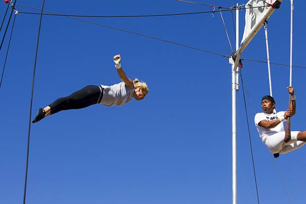 Catcher Izzie Yaakub, right, 33, watches Olga Balcaza, 31, of Chile practices at Terry Cavaretta Trapeze Experience in the Las Vegas Sports Park, 1400 N. Rampart Blvd., Wednesday, Oct. 2, 2013. The Trapeze Experience will celebrate their grand opening at the Sports Park Friday, Oct. 4. There will be a free show, open to the public, from 4 p.m. to 6 p.m.