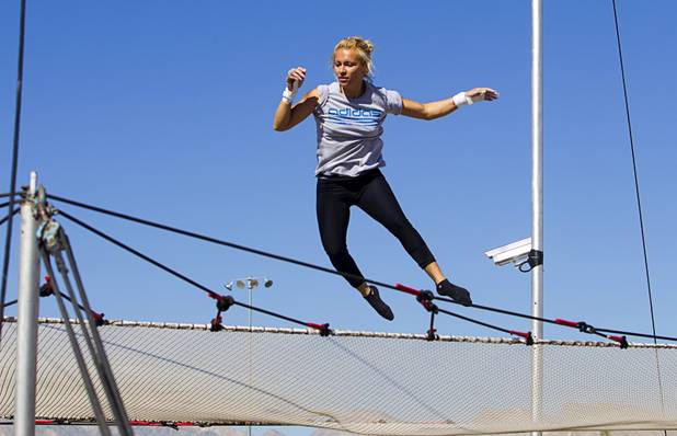 Olga Balcaza, 31, of Chile bounces up from the net during practice at Terry Cavaretta Trapeze Experience in the Las Vegas Sports Park, 1400 N. Rampart Blvd., Wednesday, Oct. 2, 2013. The Trapeze Experience will celebrate their grand opening at the Sports Park Friday, Oct. 4. There will be a free show, open to the public, from 4 p.m. to 6 p.m.