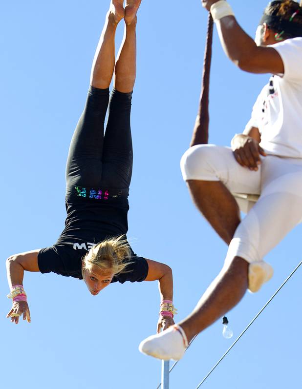 Taelyr Lazaris, 20, practices with catcher Izzie Yaakub, 33, Terry Cavaretta Trapeze Experience, 1400 N. Rampart Blvd., Wednesday, Oct. 2, 2013. The Trapeze Experience will celebrate their grand opening at the Las Vegas Sports Park Friday, Oct. 4. There will be a free show, open to the public, from 4 p.m. to 6 p.m.
