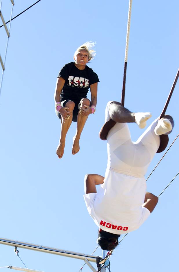 Taelyr Lazaris, 20, practices with catcher Izzie Yaakub, 33, Terry Cavaretta Trapeze Experience, 1400 N. Rampart Blvd., Wednesday, Oct. 2, 2013. The Trapeze Experience will celebrate their grand opening at the Las Vegas Sports Park Friday, Oct. 4. There will be a free show, open to the public, from 4 p.m. to 6 p.m.