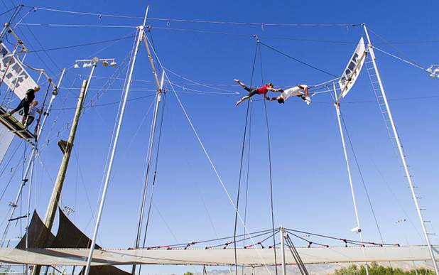 Terry Cavaretta-St.Jules, left, 60, owner of Terry Cavaretta Trapeze Experience practices with catcher Izzie Yaakub, 33, at the Las Vegas Sports Park, 1400 N. Rampart Blvd., Wednesday, Oct. 2, 2013. The Trapeze Experience will celebrate their grand opening at the Sports Park Friday, Oct. 4. There will be a free show, open to the public, from 4 p.m. to 6 p.m.