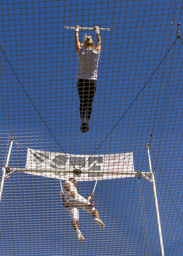 Catcher Izzie Yaakub, 33, watches Olga Balcaza, 31, of Chile practices at Terry Cavaretta Trapeze Experience in the Las Vegas Sports Park, 1400 N. Rampart Blvd., Wednesday, Oct. 2, 2013. The Trapeze Experience will celebrate their grand opening at the Sports Park Friday, Oct. 4. There will be a free show, open to the public, from 4 p.m. to 6 p.m.