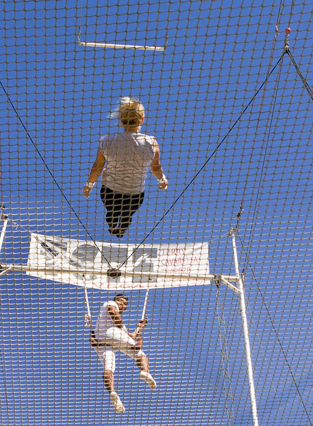 Catcher Izzie Yaakub, 33, watches Olga Balcaza, 31, of Chile practices at Terry Cavaretta Trapeze Experience in the Las Vegas Sports Park, 1400 N. Rampart Blvd., Wednesday, Oct. 2, 2013. The Trapeze Experience will celebrate their grand opening at the Sports Park Friday, Oct. 4. There will be a free show, open to the public, from 4 p.m. to 6 p.m.