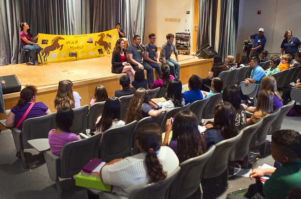 “War Horse” puppeteers Mairi Babb, Jon Hoche and Jon Riddleberger and actor Andy Truschinski visit with sixth-graders at Cram Middle School on Thursday, Oct. 3, 2013. One hundred Cram students and teachers will attend a performance of “War Horse,” part of Smith Center's Broadway series, at the center Friday.
