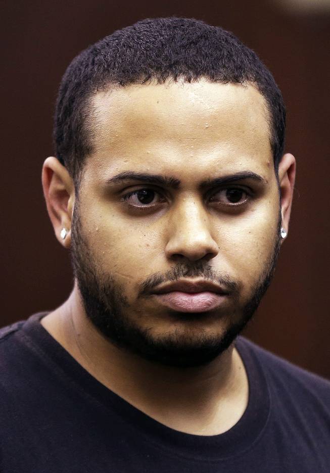 Christopher Cruz appears in criminal court in New York, Wednesday, Oct. 2, 2013. Cruz was charged with reckless driving after prosecutors said he touched off a tense encounter with the driver of an SUV and a throng of other bikers.