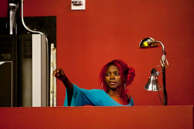 Producer Wassa Coulibaly works in the sound booth during rehearsal of "Tribal Night" at Baobab Theater at Town Square in Las Vegas Saturday, October 5, 2013.