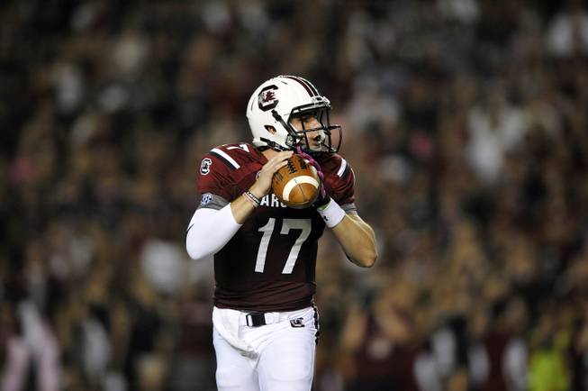South Carolina quarterback Dylan Thompson (17) looks to throw against Kentucky during the first half of an NCAA college football game, Saturday, Oct. 5, 2013, in Columbia, S.C. 