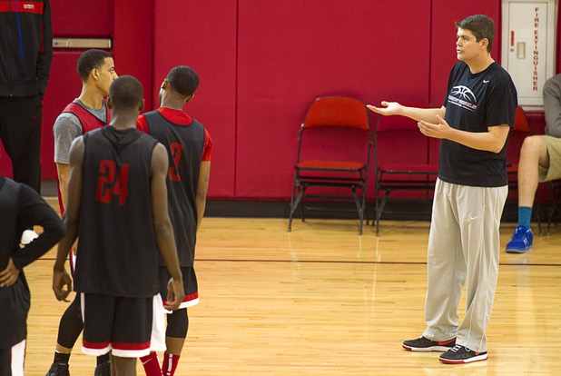 Head Coach Dave Rice, right, talks with players during the first UNLV basketball practice of the season at UNLV's Mendenhall Center Monday, Oct. 7, 2013.