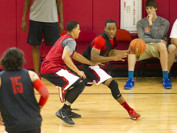 Kendall Smith, left, covers Kevin Olekaibe during the first UNLV basketball practice of the season at UNLV's Mendenhall Center Monday, Oct. 7, 2013.
