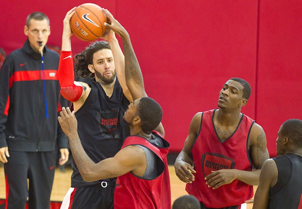 Carlos Lopez-Sosa, left, makes a rebound  during the first UNLV basketball practice of the season at UNLV's Mendenhall Center Monday, Oct. 7, 2013.
