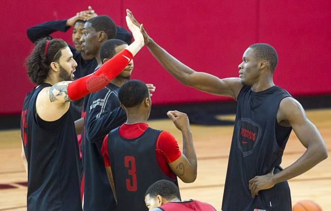 Carlos Lopez-Sosa, left, high fives with Demetris Morant during the first UNLV basketball practice of the season at UNLV's Mendenhall Center Monday, Oct. 7, 2013.