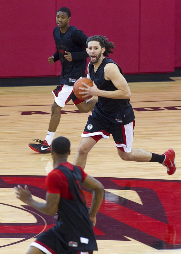 Carlos Lopez-Sosa takes the ball down court during the first UNLV basketball practice of the season at UNLV's Mendenhall Center Monday, Oct. 7, 2013.