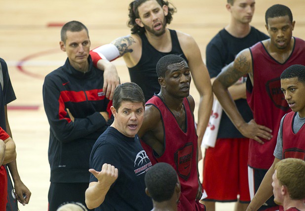 Head Coach Dave Rice talks with players during the first UNLV basketball practice of the season at UNLV's Mendenhall Center Monday, Oct. 7, 2013.