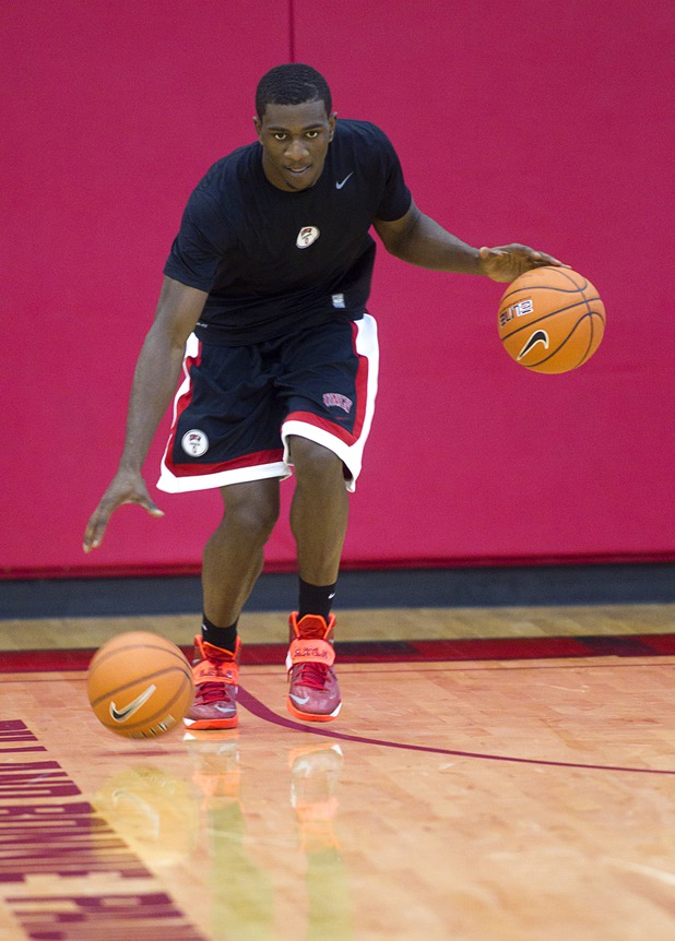 Savon Goodman dribbles two balls during the first UNLV basketball practice of the season at UNLV's Mendenhall Center Monday, Oct. 7, 2013.
