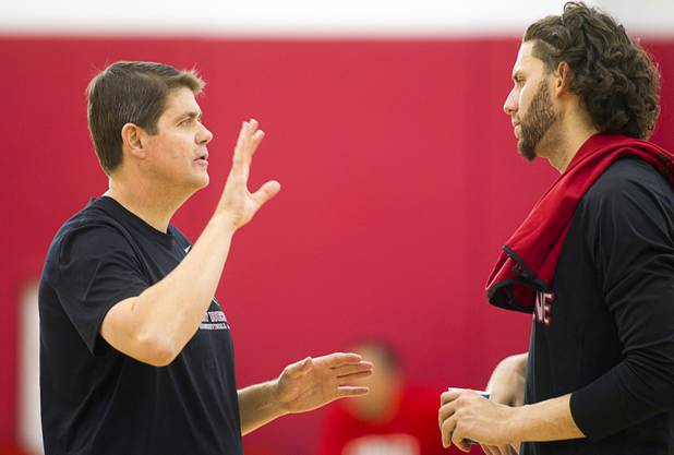 Head Coach Dave Rice talks with  during the first UNLV basketball practice of the season at UNLV's Mendenhall Center Monday, Oct. 7, 2013.