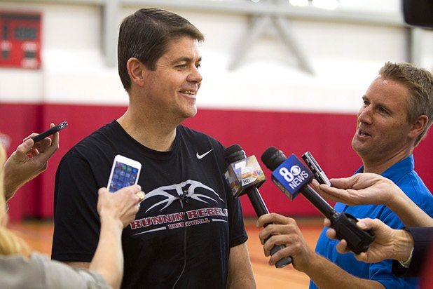 Head Coach Dave Rice talks with reporters during the first UNLV basketball practice of the season at UNLV's Mendenhall Center Monday, Oct. 7, 2013.