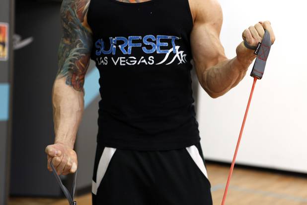 Co-owner Jason Santiago demonstrates an exercise that can be done on the board at Surfset Fitness in Las Vegas on Monday, October 7, 2013.