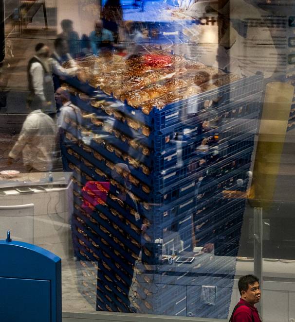 A large scrim of a bread rack reflects and opaques attendees at the International Baking Industry Exposition which brings more than 20,000 baking professionals from every segment of the grain-based market converge to the Las Vegas Convention Center for North Americas largest, most comprehensive trade event of the year.