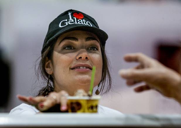 Kimberly Battistini with MEC3 of Carlstedt, Calif.,  serves another gelato to an attendee at the International Baking Industry Exposition in the Las Vegas Convention Center. Her company produces products for making gelato and pastry.    