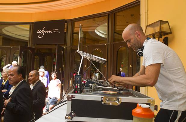 DJ Austin Hoffman provides music as fans and reports wait for boxers to arrive at the Wynn Las Vegas Resort Tuesday, Oct. 8, 2013. WBO welterweight champion Timothy Bradley Jr. will defend his title against Juan Manuel Marquez of Mexico at the Thomas & Mack Center Saturday.