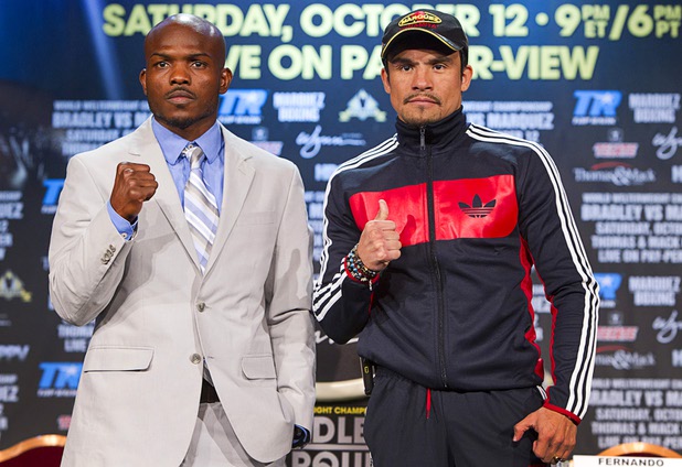 Undefeated WBO welterweight champion Timothy Bradley Jr., left, and Juan Manuel Marquez of Mexico pose during a news conference at the Wynn Las Vegas Resort Wednesday, Oct. 9, 2013. Bradley will defend his title against Marquez at the Thomas & Mack Center Saturday.