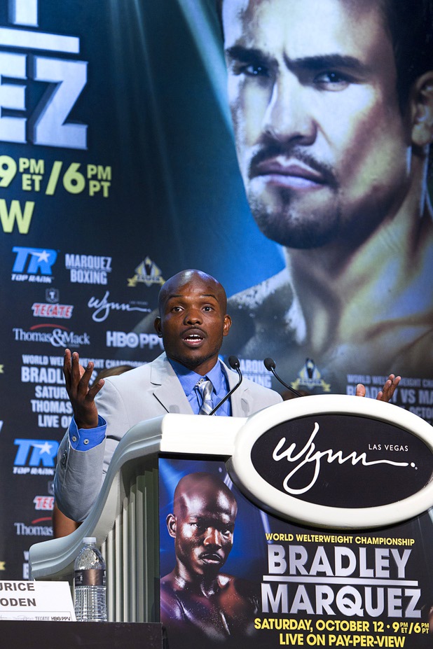Undefeated WBO welterweight champion Timothy Bradley Jr. speaks during a news conference at the Wynn Las Vegas Resort Wednesday, Oct. 9, 2013. Bradley will defend his title against Juan Manuel Marquez of Mexico at the Thomas & Mack Center Saturday. An image of Marquez appears on a banner behind Bradley.