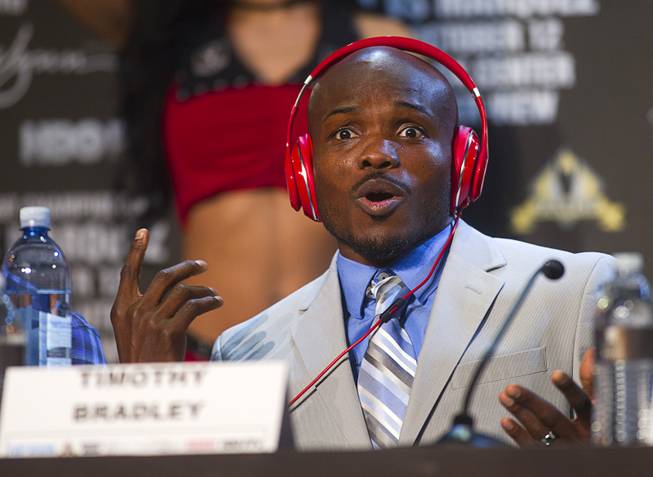 Undefeated WBO welterweight champion Timothy Bradley Jr. listens to music during a news conference at the Wynn Las Vegas Resort Wednesday, Oct. 9, 2013. Bradley will defend his title against Juan Manuel Marquez of Mexico at the Thomas & Mack Center Saturday.