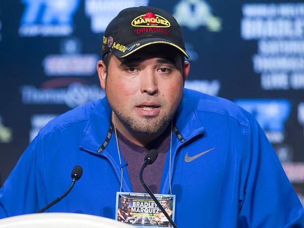 Angel Guillermo Heredia, strength and conditioning coach for Mexican boxer Juan Manuel Marquez, speaks during a news conference at the Wynn Las Vegas Resort Wednesday, Oct. 9, 2013. Marquez will challenge undefeated WBO welterweight champion Timothy Bradley Jr.  for the title at the Thomas & Mack Center Saturday.