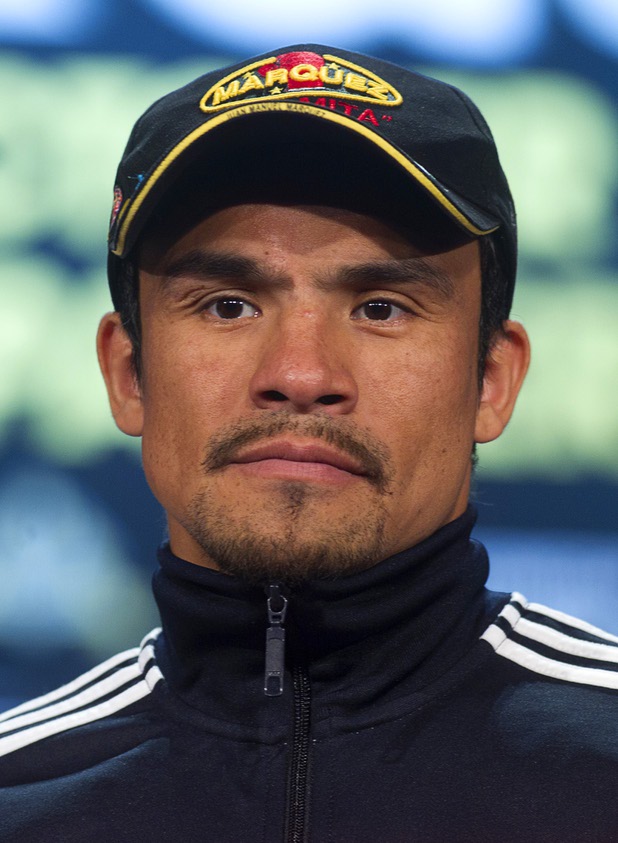 Mexican boxer Juan Manuel Marquez attends a news conference at the Wynn Las Vegas Resort Wednesday, Oct. 9, 2013. Marquez will challenge undefeated WBO welterweight champion Timothy Bradley Jr.  for the title at the Thomas & Mack Center Saturday.