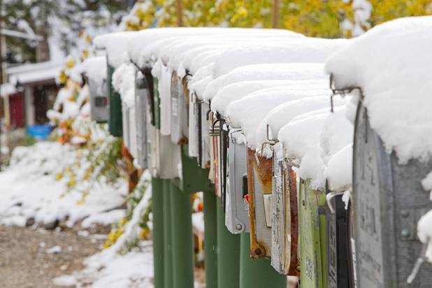Mailboxes are shown covered with snow on Mount Charleston Thursday, Oct. 10, 2013.