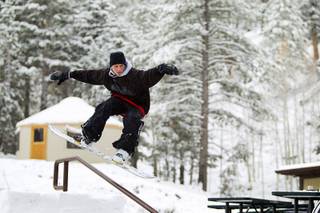 Snowboarder Jake Buell rides a handrail at the Las Vegas Ski & Snowboard Resort in Lee Canyon Thursday, Oct. 10, 2013.