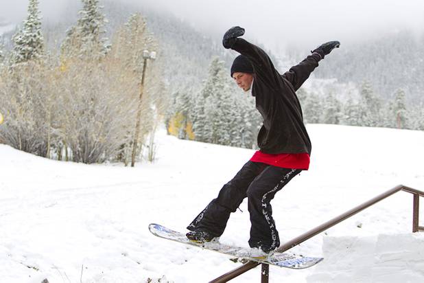 Snowboarder Jake Buell rides a handrail at the Las Vegas Ski & Snowboard Resort in Lee Canyon Thursday, Oct. 10, 2013.