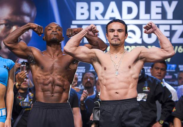 Undefeated WBO welterweight champion Timothy Bradley Jr., left, and Juan Manuel Marquez of Mexico pose during an official weigh-in at the Wynn Las Vegas Friday, Oct. 11, 2013. Bradley will defend his title against Marquez at the Thomas & Mack Center on Saturday.